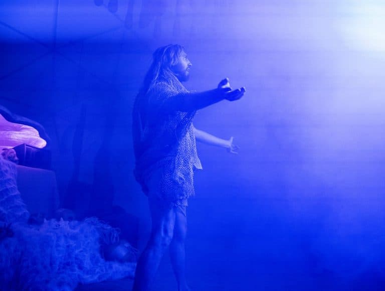 Coen performing inside the blue-lit dome