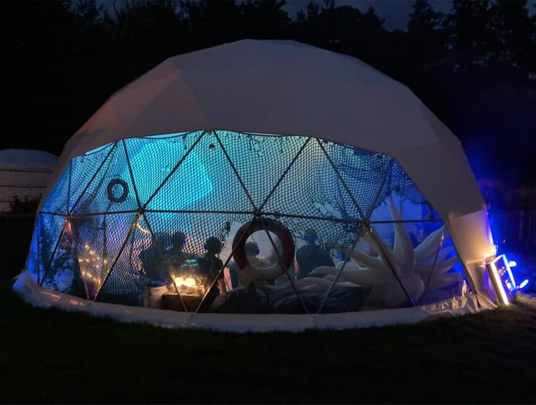 Geodesic dome glowing at night
